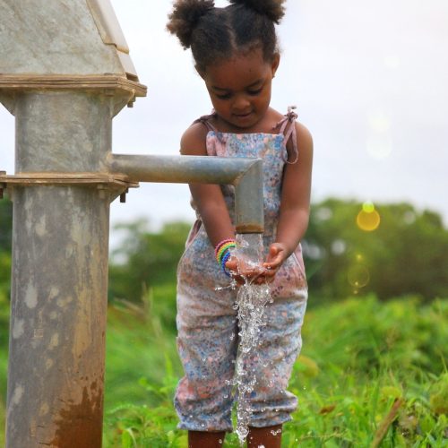 girl-washing-her-hands-at-a-water-well-in-burkina-faso-africa.jpg